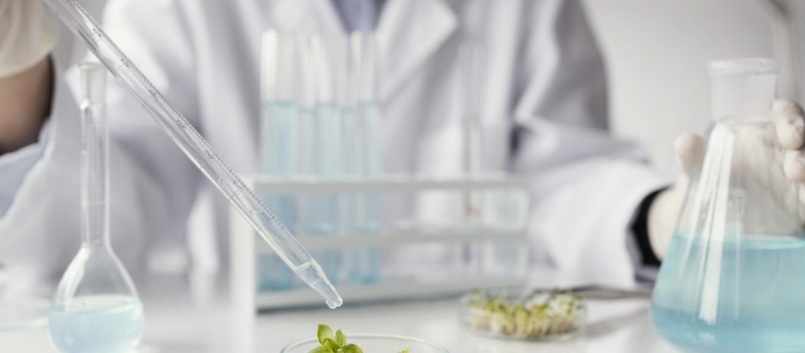 close-up-researcher-with-pipette